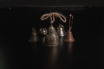 Obraz na płótnie Canvas Solid brass or bronze vintage bell on black background