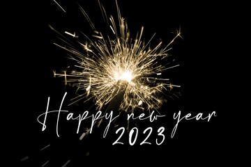 Happy new year 2023 yellow sparkler new years eve countdown. Luxury entertainment celebration turn of the year party time. Premium nightlife visual with glowing light sparks on dark background