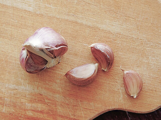 Garlic cloves on a cutting board. garlic