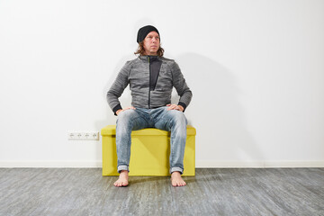 Man sitting on a green box