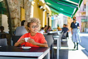 drinks and people concept - happy woman with cup drinking cafe at city street cafe terrace