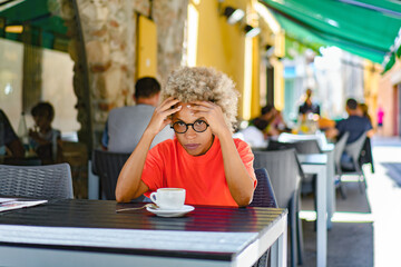 nervous woman looking out somebody while drinking coffee