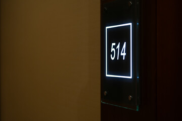 element detail from a hotel. interior photo. room number.