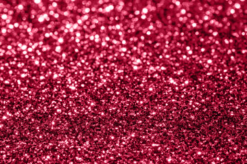 Viva Magenta background with blurry sparkles.