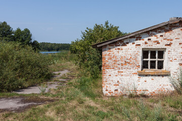 The window of a ruined house. Ruins of an old farm 