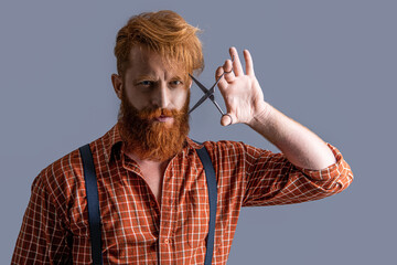 barber bearded man in studio. barber bearded man at barbershop on background.