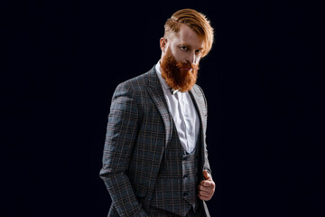 photo of formal man in menswear with beard. formal man in menswear isolated on black.