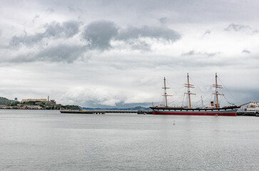 Fototapeta na wymiar Pier in San Francisco, California. Alcatraz in Background. USA