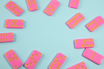 Pink domino on cyan background
