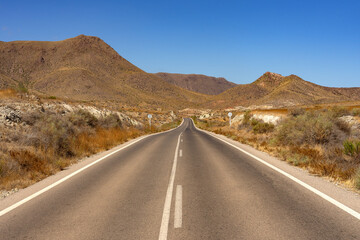 Road in the desert zone in the Gata Cape Natural Park coast. Almería, Andalucía, Spain..