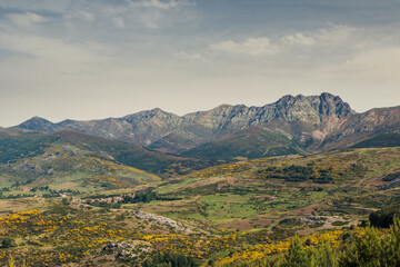 Fototapeta na wymiar Mountain landscape photography. Route of the reservoirs in the mountains of Palencia with the Curavacas peak in the background