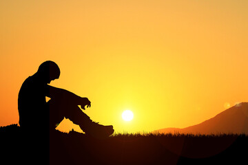 The concept of loneliness and heartbreak was abandoned. silhouette of a lone man in the meadow