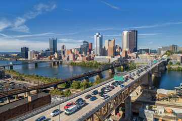 Fototapeta na wymiar Pittsburgh Skyline with Downtown and Business District. Train Bridge and Liberty Bridge.