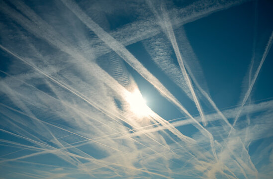 Jet vapor trails on blue sky