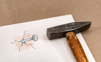 Symbolbild Hammer und Nagel