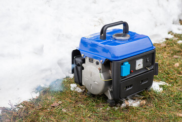 Just started two-stroke gasoline electric generator produces much smoke because of burning motor...