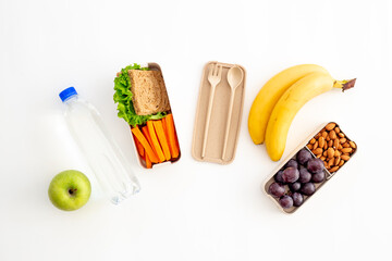 Lunch boxes with food ready to go and bamboo cutlery