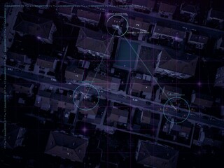 Aerial surveillance concept - suspects cars and meeting location tracked by an AI aerial location surveillance system.