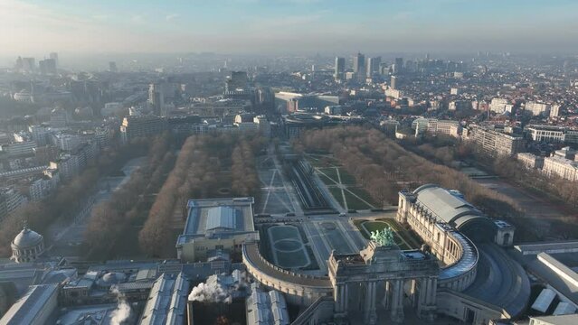 Jubelpark, Park of the Fiftieth Anniversary in Brussels, Belgium. Europe. Urban monumental park, aerial drone overhead city skyline view. Arc de Triomphe, Cinquantenaire park. Winter day.