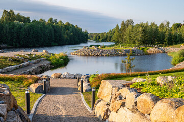 View of a park next to a river. Nykarleby/Uusikaarlepyy., Finland
