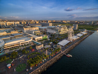 Fototapeta na wymiar Mall of Asia in Bay City, Pasay, Manila Philippines with Pier and Cityscape.