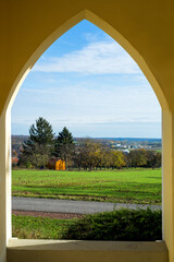  View through stone window in the wall of castle.