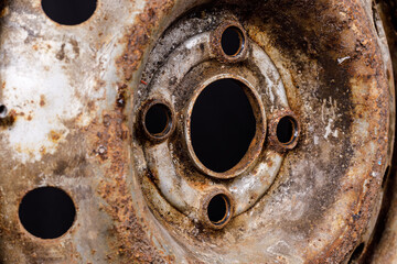 old metal car rim with rust closeup