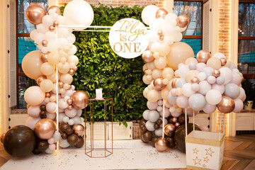 Decorations for children's birthday. Lots of balls, cake, photos, vases, toys