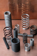 Different sizes springs on the copper background.