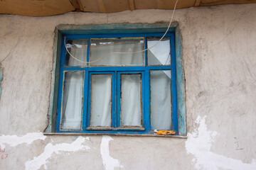 old window in the wall , blue  window