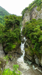 Fototapeta na wymiar Incredible waterfalls in the middle of nature in the mountains of Ecuador