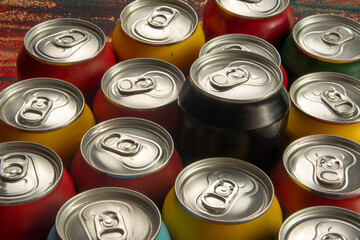Soda cans for conceptual use representing that of calorie intake and obesity with a black can sticking out of the middle