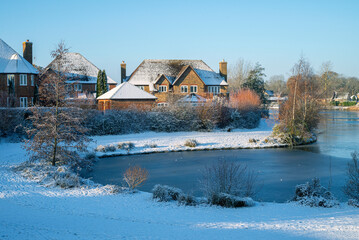 Leftover snow in a beautiful neighbourhood of Furzton Lake on sunny morning in December 1