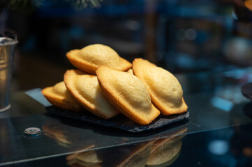 French sweet dessert pastry madeleine on display in french bakery
