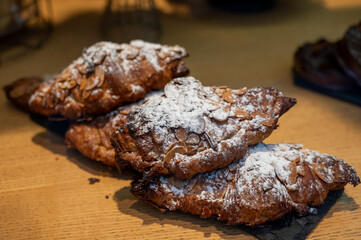 French sweet dessert pastry with almonds on display in french bakery