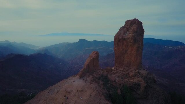 Roque Nublo mountain in Gran Canaria, Canary Islands on a blue day. Cinematic camera movement. High quality FullHD footage