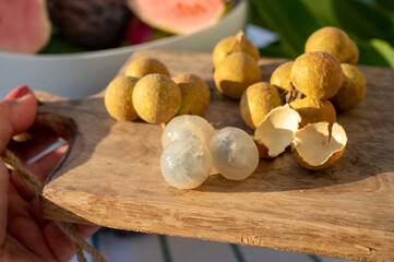 Tasty tropical exotic fruits, ripe fresh peeled lychee fruits