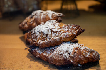 French sweet dessert pastry with almonds on display in french bakery