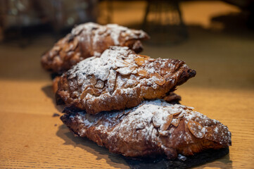 French sweet dessert pastry with almonds on display in french bakery