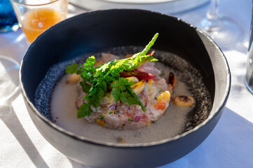 Tartare of seabass with mango, passion fruit and coconut milk