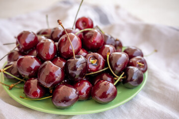 Giant fresh ripe black cherries, new harvest, ready to eat close up