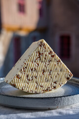 White sheep cheese with aromatic black cumin seeds served outdoor