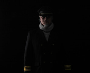 portrait of a ship captain on a black background