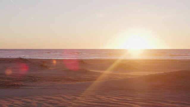 Panning shot along Pismo Beach California at sunset