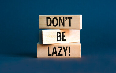 Naklejka premium Motivational and do not be lazy symbol. Concept words Do not be lazy on wooden blocks on a beautiful grey table grey background. Business do not be lazy concept. Copy space.