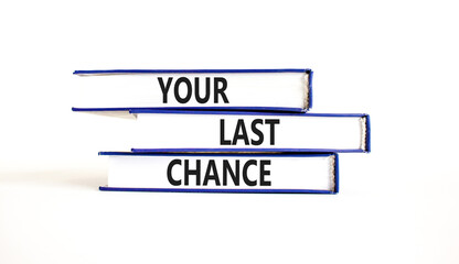 Time to your last chance symbol. Concept words Your last chance on books on a beautiful white table white background. Business and your last chance concept. Copy space.
