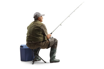 Fisherman sitting on a chair with a fishing rod