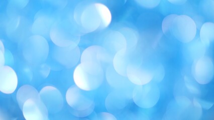 Obraz premium Blue Christmas Festive blurred bokeh background. Glitter Soft-Focus Lights Flashing