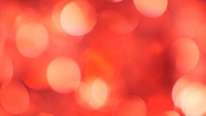 Red Christmas Festive blurred bokeh background. Glitter Soft-Focus Lights Flashing
