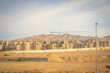 Fototapeta na wymiar Huge housing complex in construction being build near Aqaba Jordan, new houses on the seaside in Aqaba, Jordan 